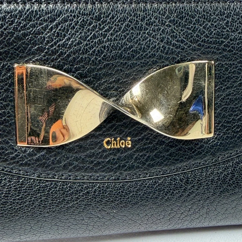 Chloe Twisted Bow Zip Around Wallet Womens Long Black Pebbled Leather Gold